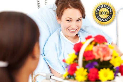 Flowers being delivered to a smiling patient